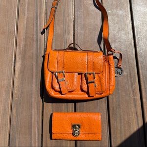 Michael Kors medium size orange purse and matching full-size wallet.